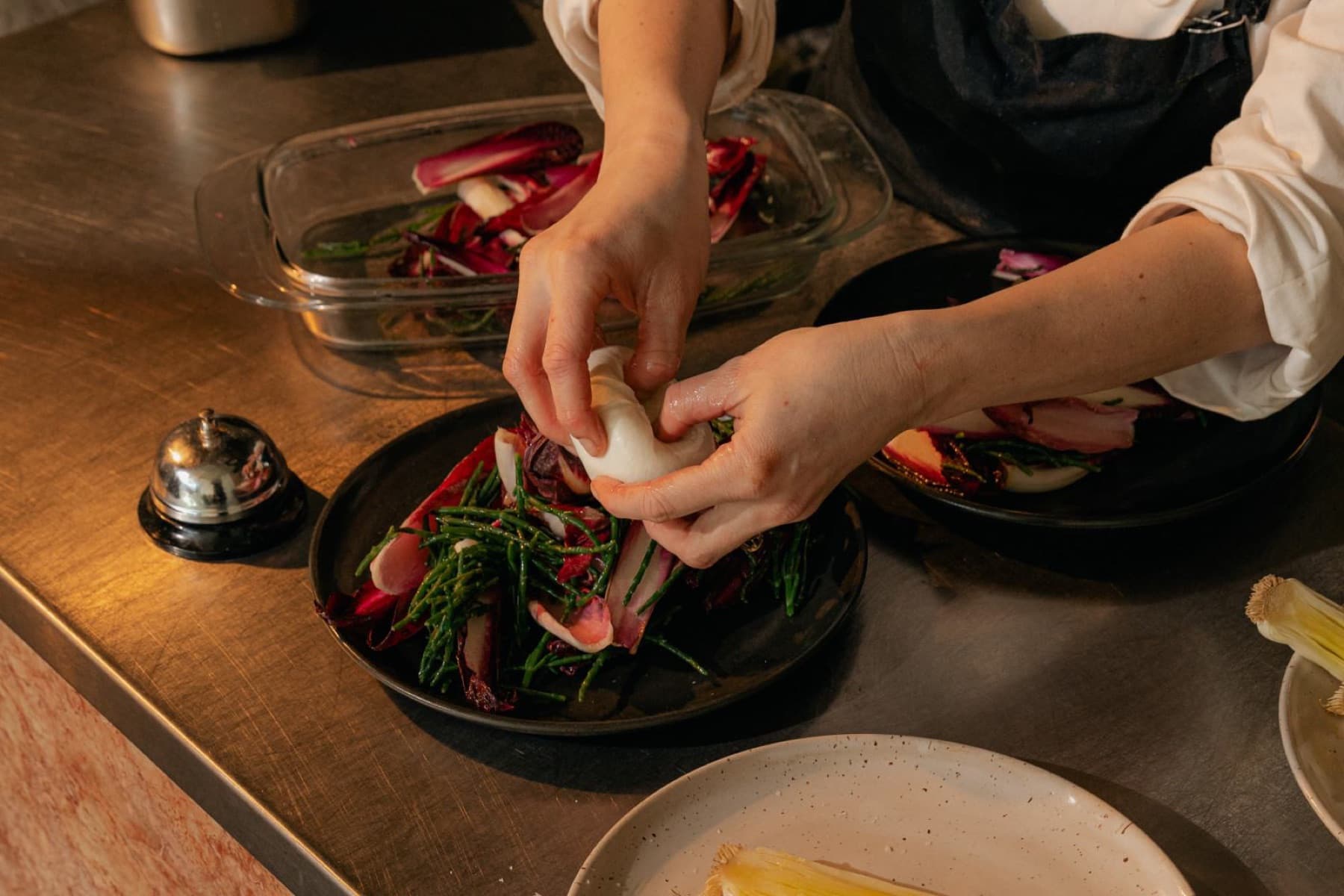 A creator-chef plating a dish